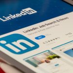 The LinkedIn app store listing open on a tablet screen, representing the personal LinkedIn account that automation tools put at risk of restriction.