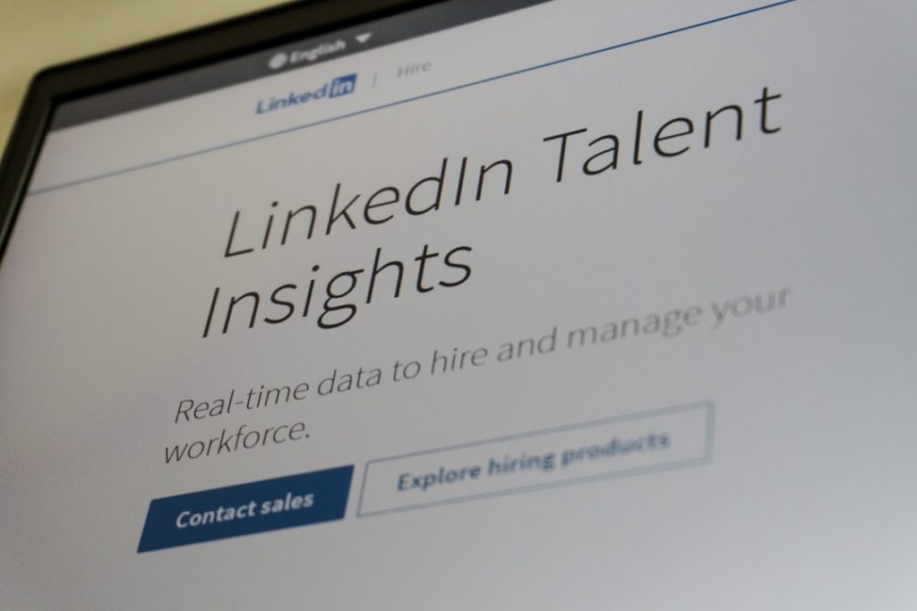 A laptop screen open to a LinkedIn page, the platform whose automation rules decide which outreach tools are safe to run on your account.