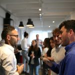Sales professionals in conversation, illustrating the difference between warm leads and hot leads
