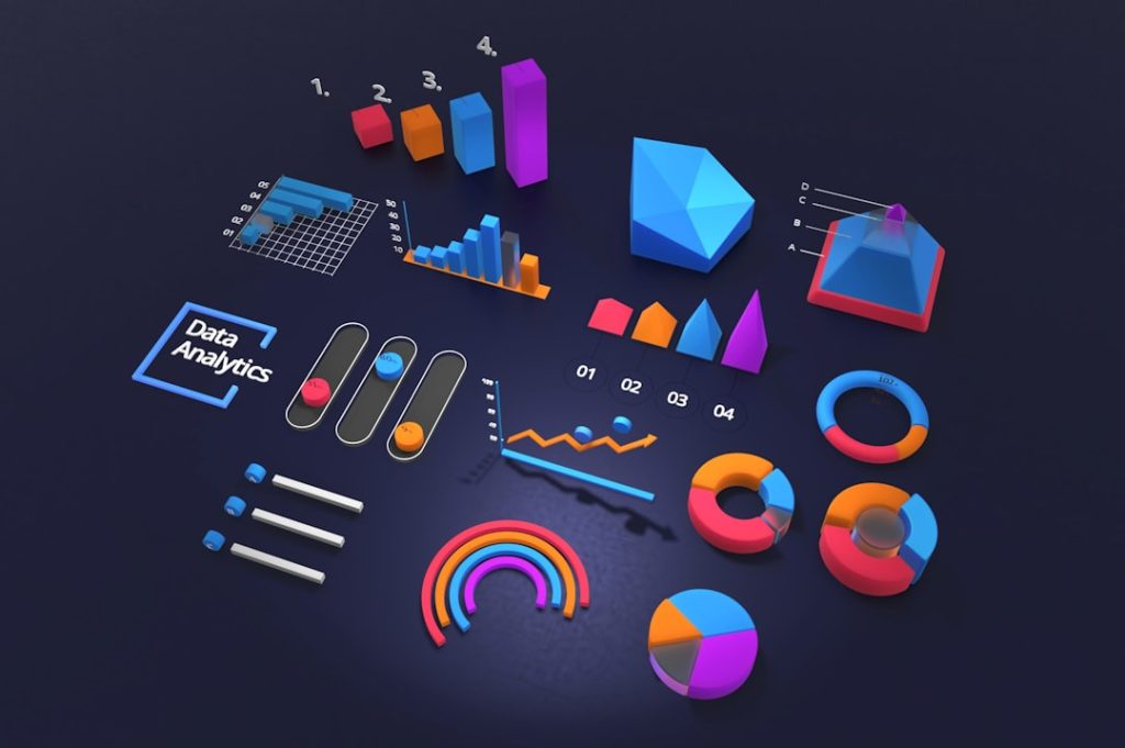 A dark navy surface arranged with colorful 3D chart shapes: a row of ranked bars numbered one to four, a line graph trending upward, several donut and pie charts, sliders, a segmented pyramid and a rainbow gauge, beside a bracketed label reading Data Analytics.